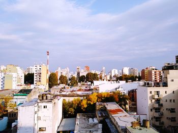 High angle view of buildings in city against sky