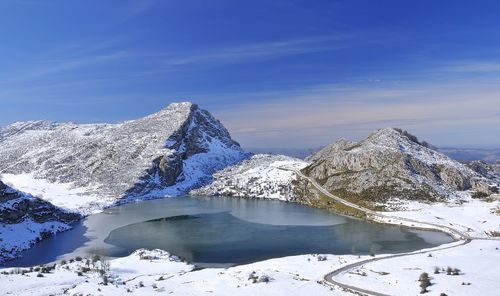 Scenic view of snowcapped mountains against sky during winter