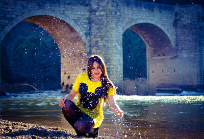 Portrait of young woman in sea