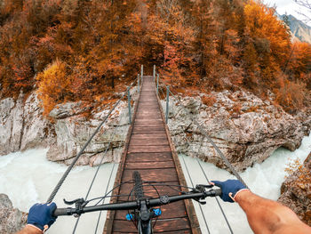 Low angle view of man on road during autumn