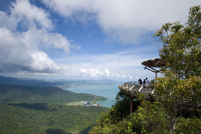 Scenic view of building and mountains against sky