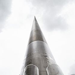 Low angle view of modern office building against sky