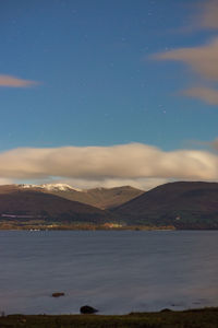 Scenic view of loch lomond against sky at night