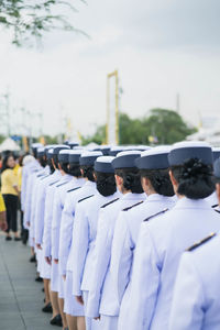 Rear view of soldiers on footpath during parade