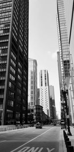 City street amidst buildings against sky