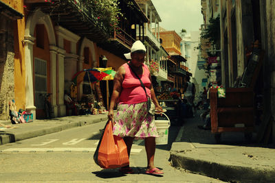 Portrait of woman walking on street