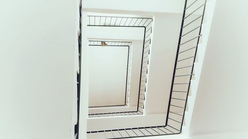 Directly below shot of spiral staircase of building