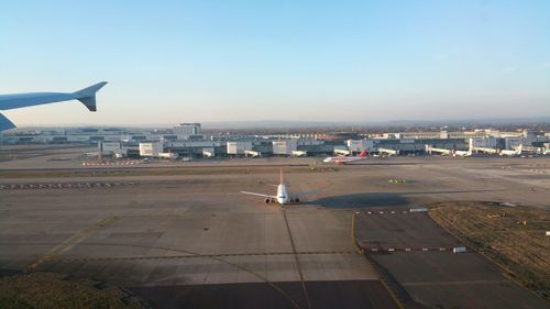 Airplane flying over city