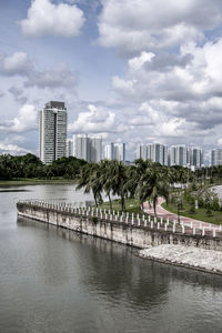 City buildings against cloudy sky