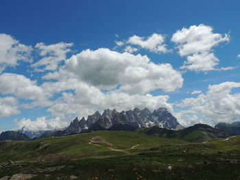 Scenic view of landscape and mountains against sky