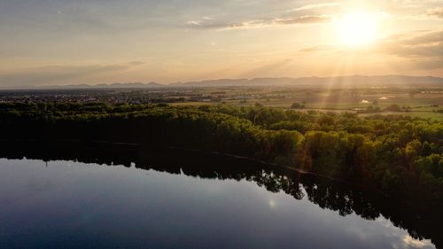 Scenic view of lake against sky during sunset