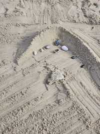 High angle view of footprints on sand