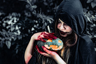 Portrait of woman holding ice cream