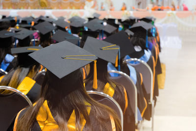 Students sitting in auditorium during graduation ceremony