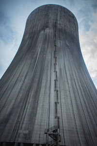 Low angle view of modern building against cloudy sky