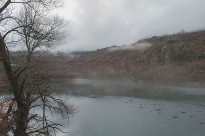 Scenic view of landscape against cloudy sky