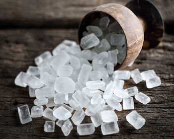 Rock sugar on wooden background.