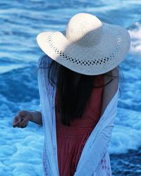 Rear view of woman wearing hat