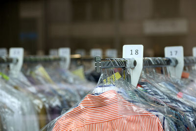 Close-up of clothes hanging on display at store