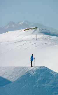 Man skiing on snowcapped mountain