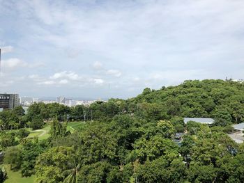 High angle view of trees and buildings against sky