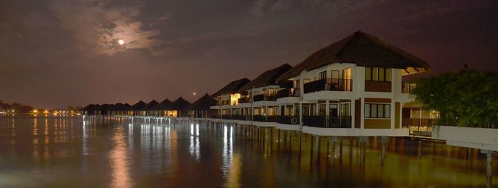 Reflection of illuminated built structure in water