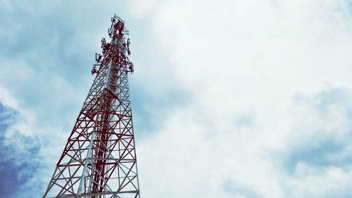 Low angle view of communications tower against sky