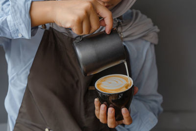 Midsection of man holding bag
