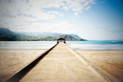 Gazebo on beach against sky