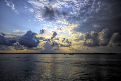 Scenic view of sea against dramatic sky