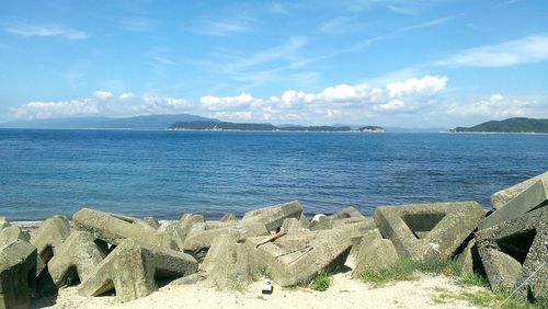 Scenic view of sea against cloudy sky