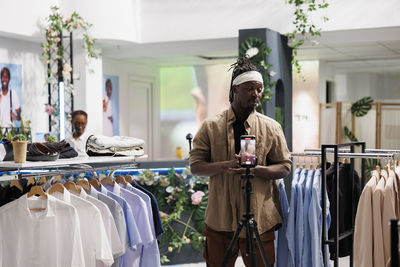 Rear view of woman standing in store