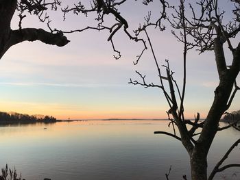 Scenic view of sea against sky at sunset