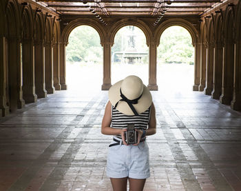 Woman standing in corridor