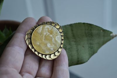 Close-up of person holding jewelry