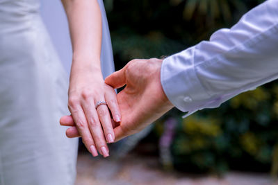 Bouquet in the hands of the groom. to make a happy wedding gift to a young bride.