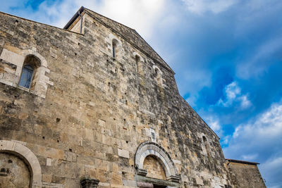 Low angle view of old building against sky