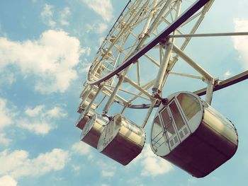 Low angle view of ferris wheel against sky