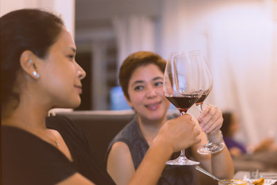 Portrait of smiling woman holding drink