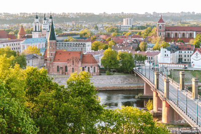 High angle view of bridge over river amidst buildings