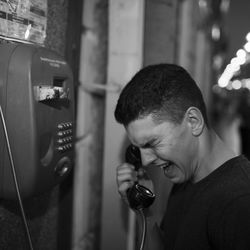 Portrait of young man using mobile phone