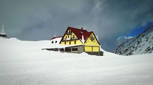 View of snowcapped landscape against sky