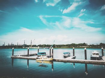 Boats moored at harbor