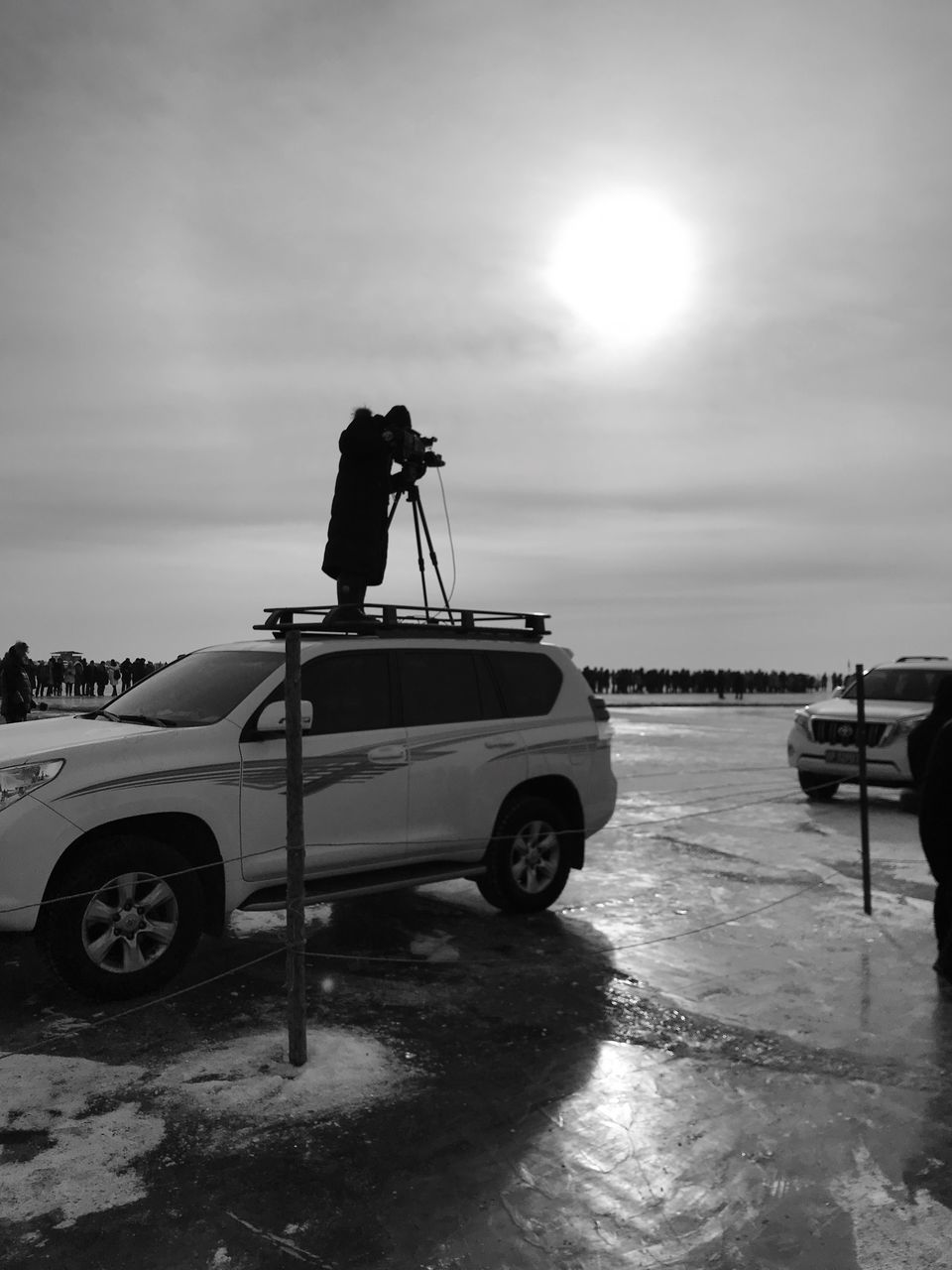 transportation, car, sky, mode of transport, cloud - sky, water, real people, sea, men, outdoors, nature, land vehicle, two people, beach, day, full length, people