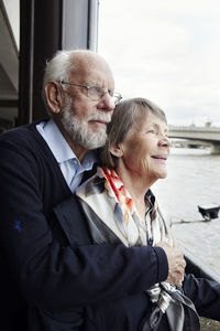 Senior couple looking at river