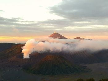 View of volcanic landscape against sky during sunset