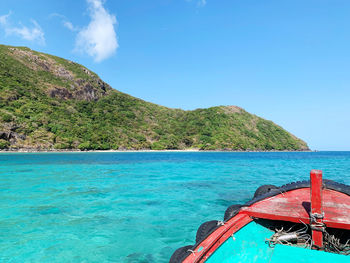 Scenic view of sea against blue sky