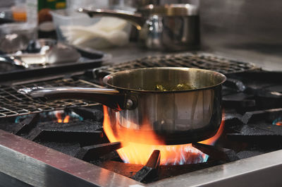 Cooking pan on burning store at home