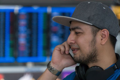 Close-up of young man talking on phone