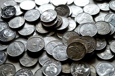 High angle view of coins on table